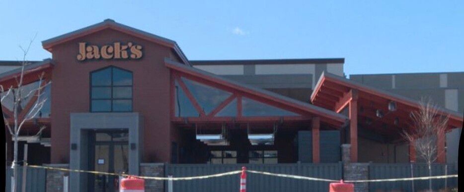 Jack’s restaurant storefront with red roof beams and a central entrance sign