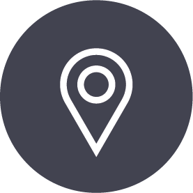 White location pin icon on a dark gray circle.