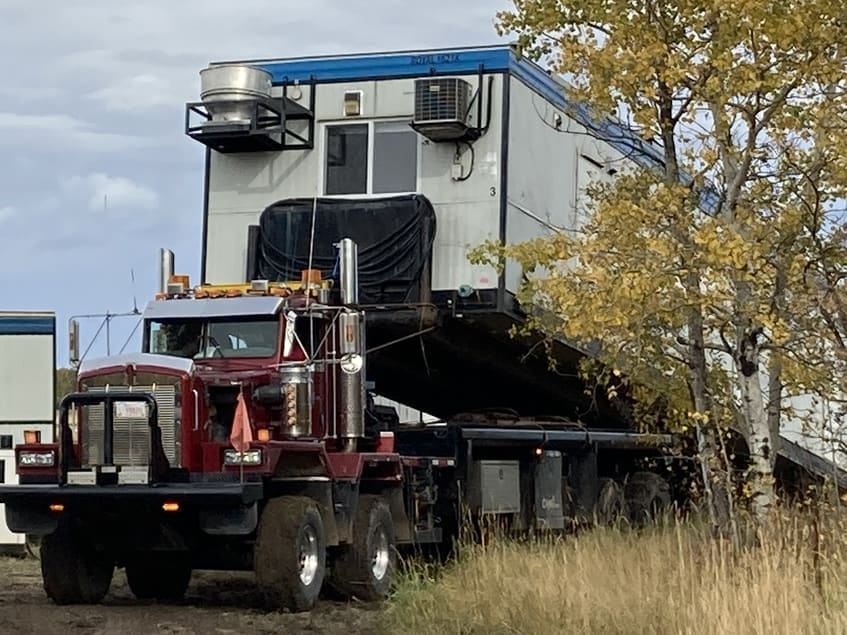 winch tractors with hi boy trailers hauling in British Columbia.