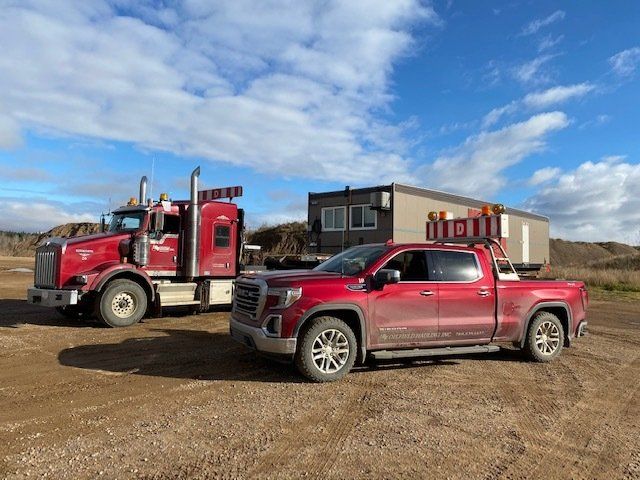 winch tractors with hi boy trailers hauling in British Columbia.