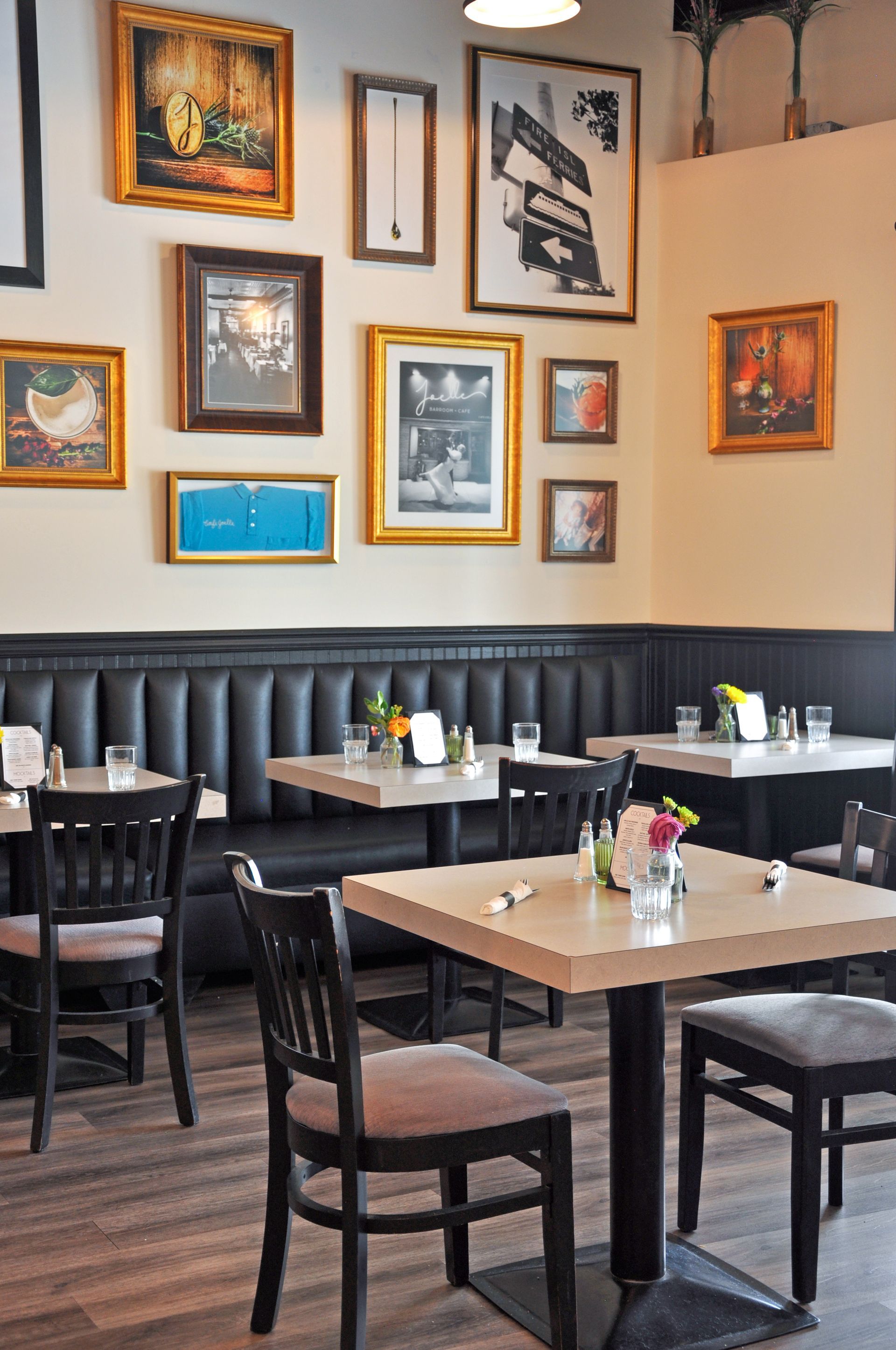 A restaurant with tables and chairs and pictures on the wall
