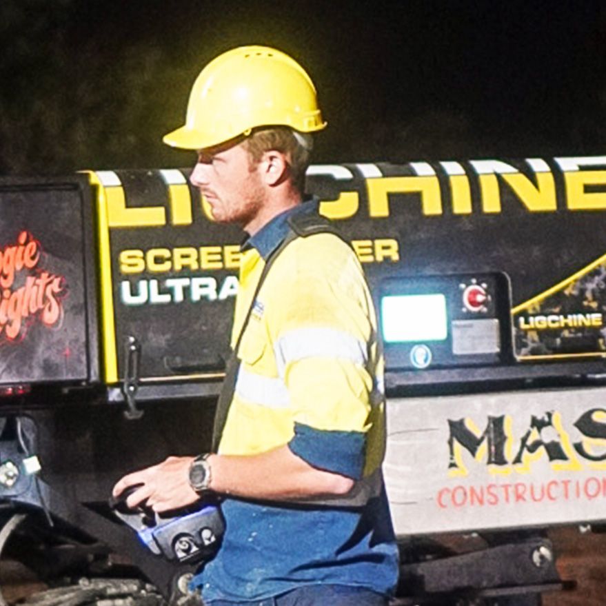 An Excavator Is Loading Dirt — Mass Construction Group Australia Pty Ltd in South Mackay, QLD