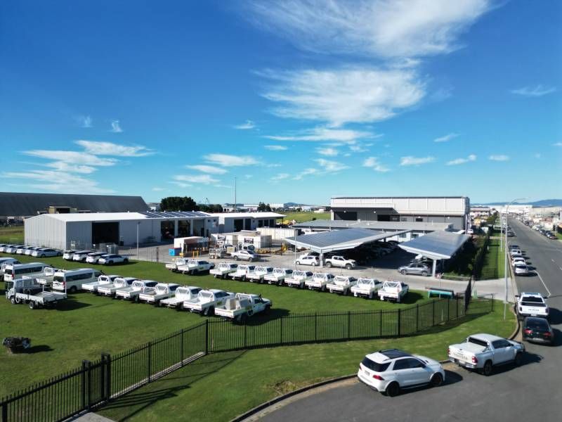 A Large Building with Cars parked out Front — Mass Construction Group Australia Pty Ltd in South Mackay, QLD