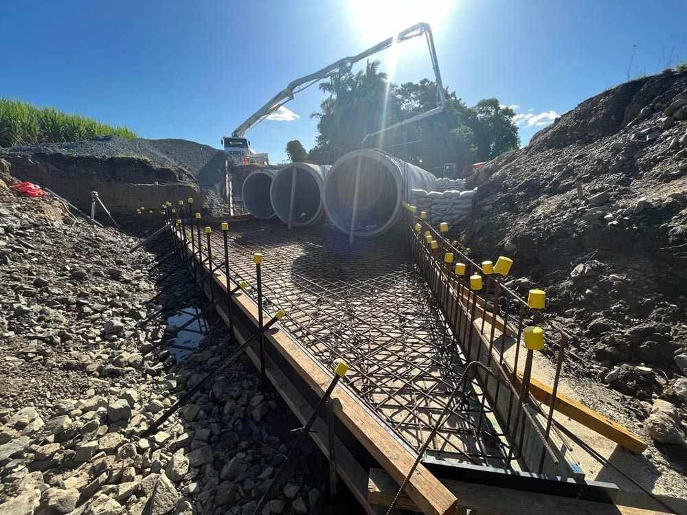 A Construction Site with A Concrete Pump in The Background — Mass Construction Group Australia Pty Ltd in South Mackay, QLD
