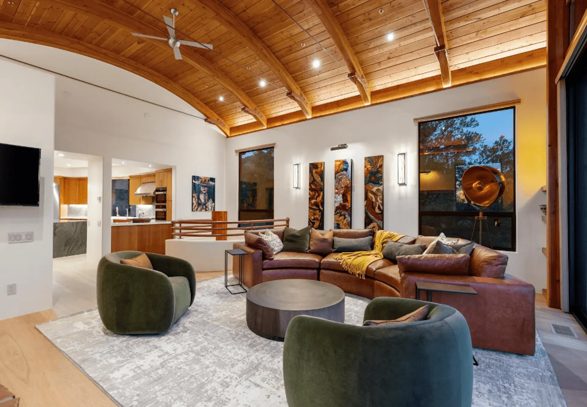 A living room filled with furniture and a ceiling fan