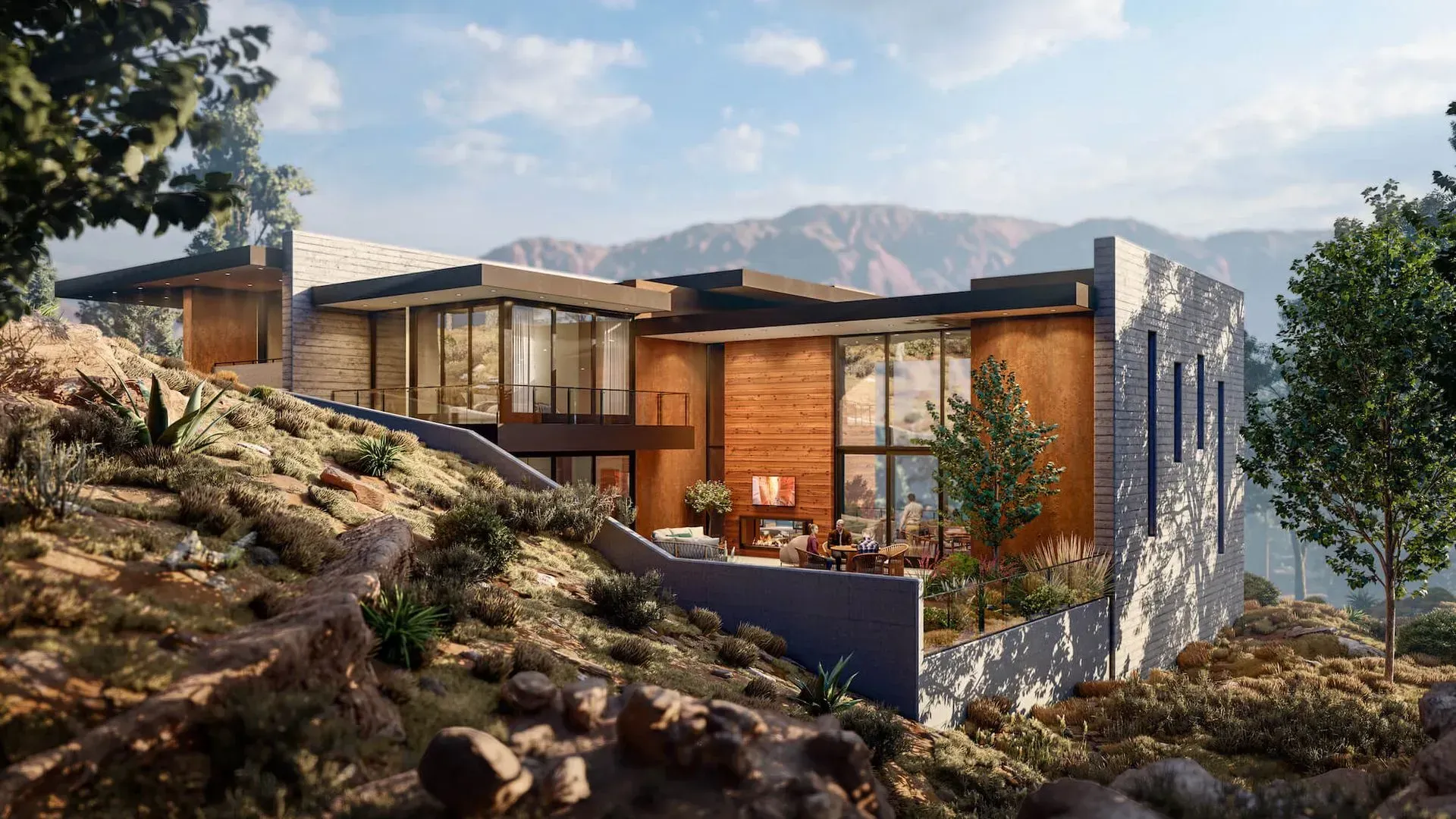 Modern hillside house with wood and stone exterior, glass walls, and mountain views at sunset