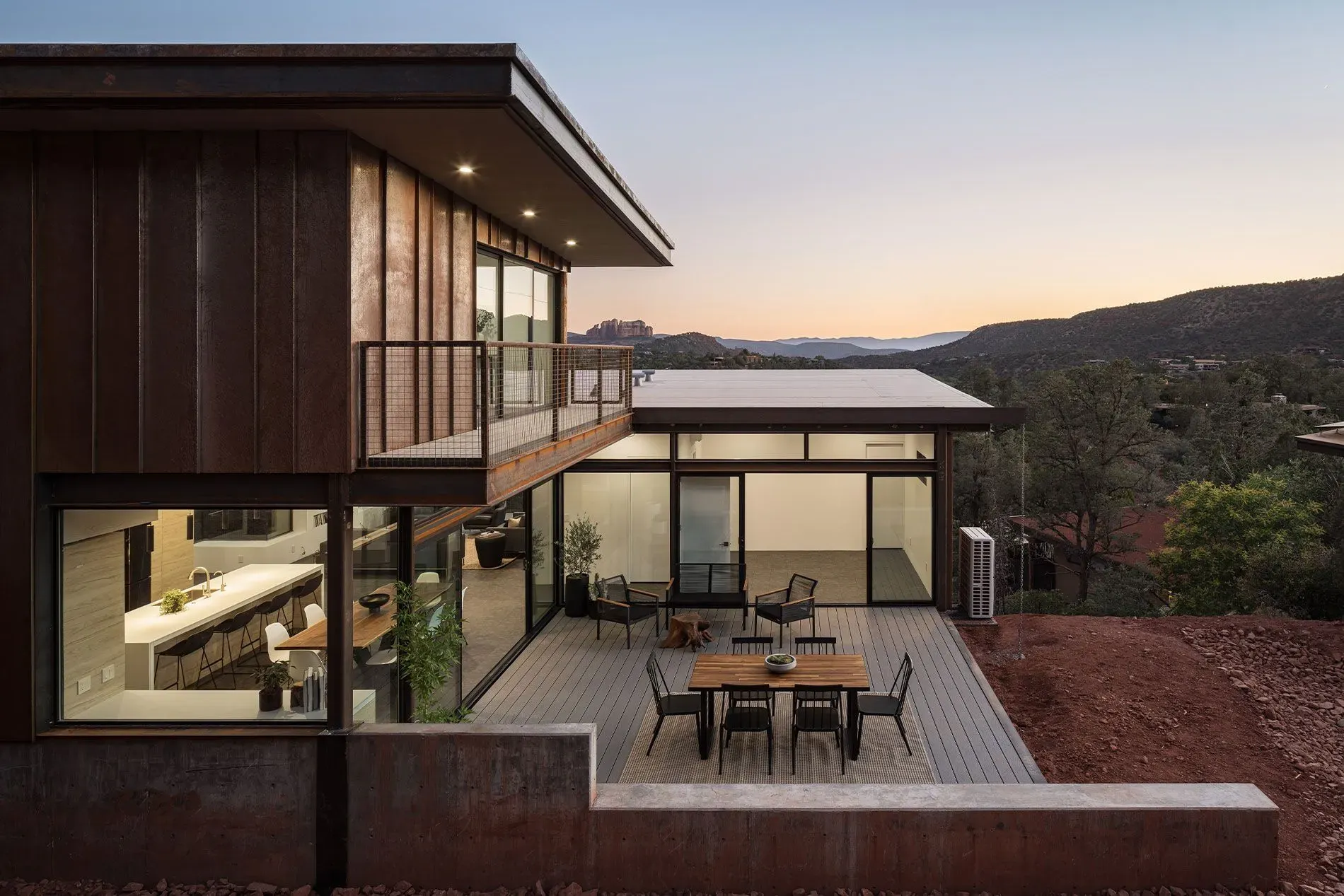 Modern house with glass walls and a courtyard patio