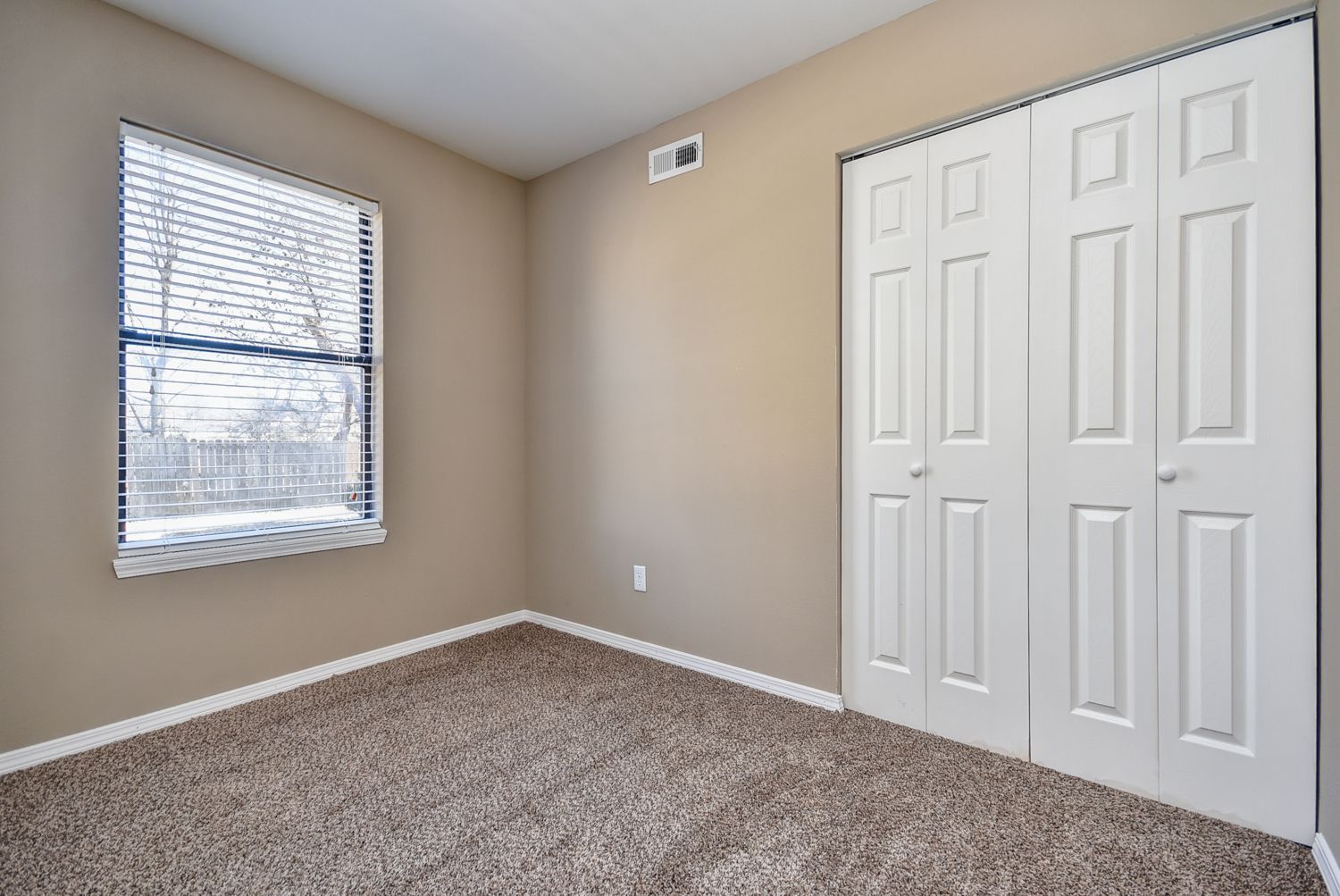 Photo of a bedroom with a two-door cabinet