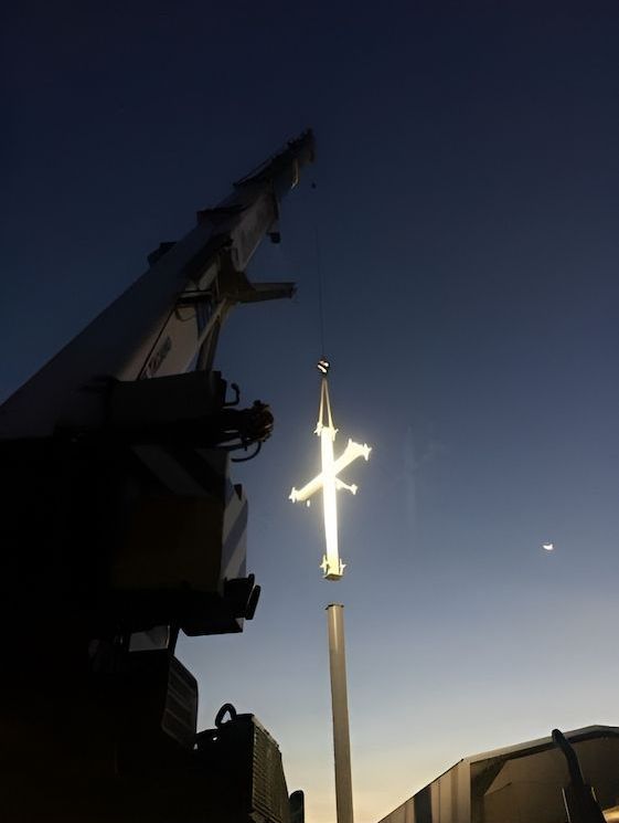 A Crane Is Lifting A Cross Into The Air — Jakes Steel & Welding in East Arm, NT