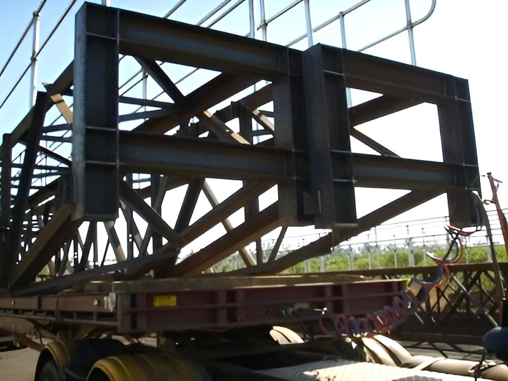A Large Metal Structure Is Sitting On Top Of A Trailer — Jakes Steel & Welding in East Arm, NT