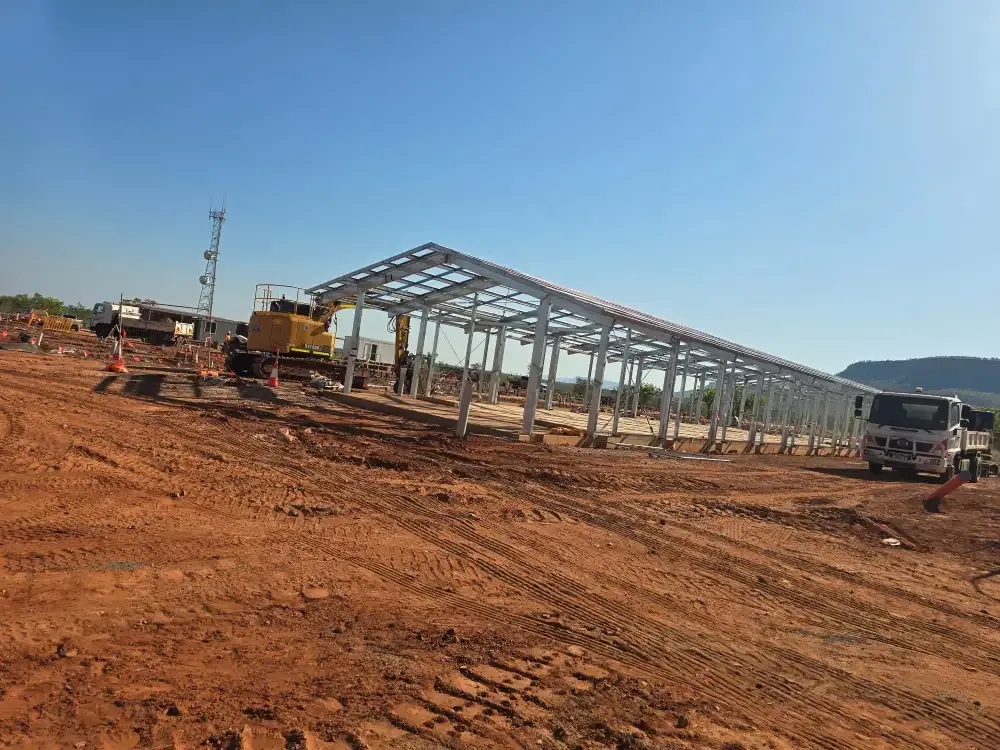 A Truck Is Parked In Front Of A Building Under Construction In A Dirt Field — Jakes Steel & Welding in East Arm, NT