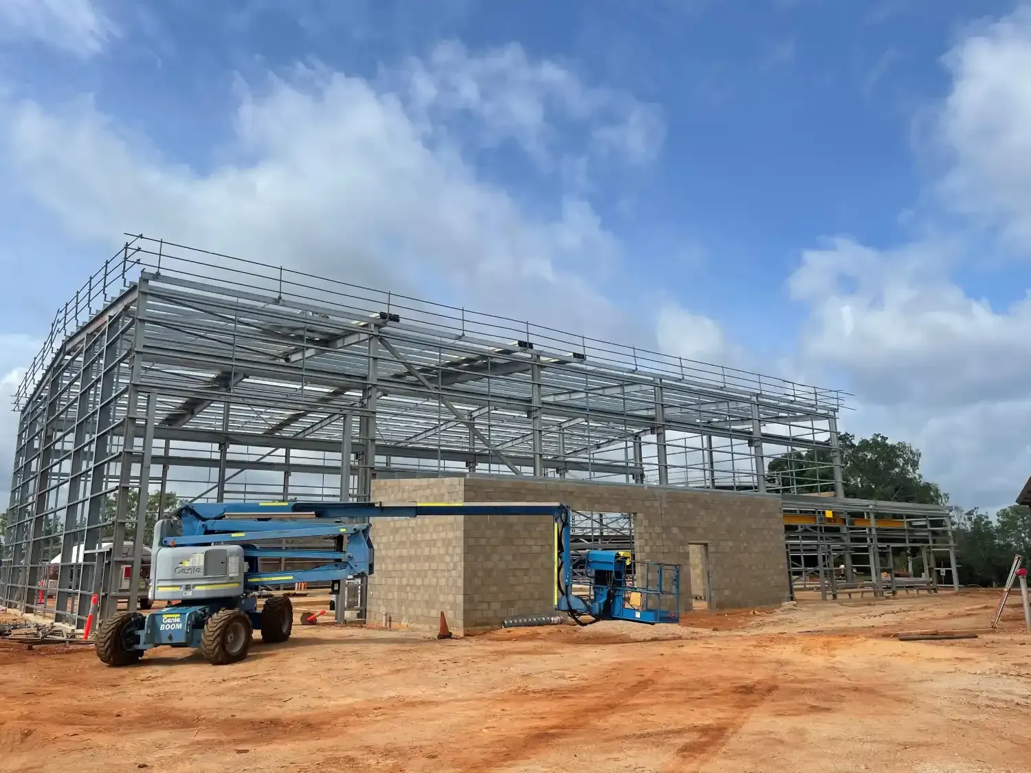 A Large Metal Structure Is Being Built In A Dirt Field — Jakes Steel & Welding in East Arm, NT