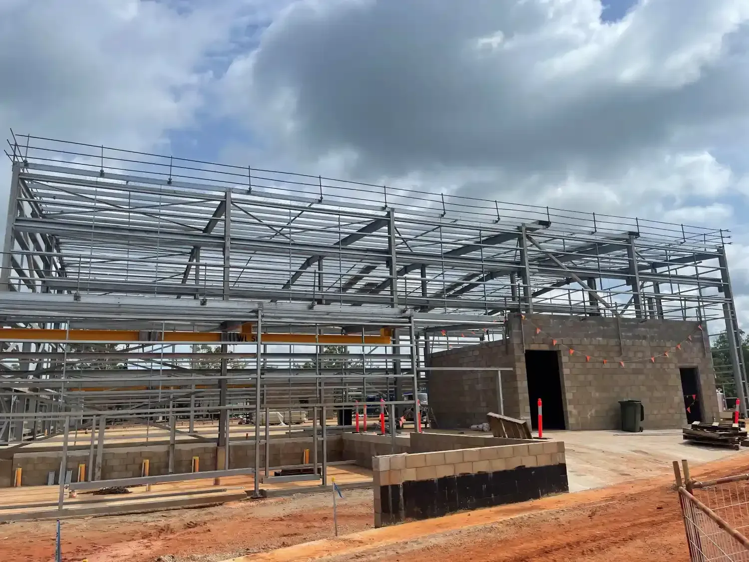 A Large Metal Structure Is Being Built On Top Of A Dirt Field — Jakes Steel & Welding in East Arm, NT