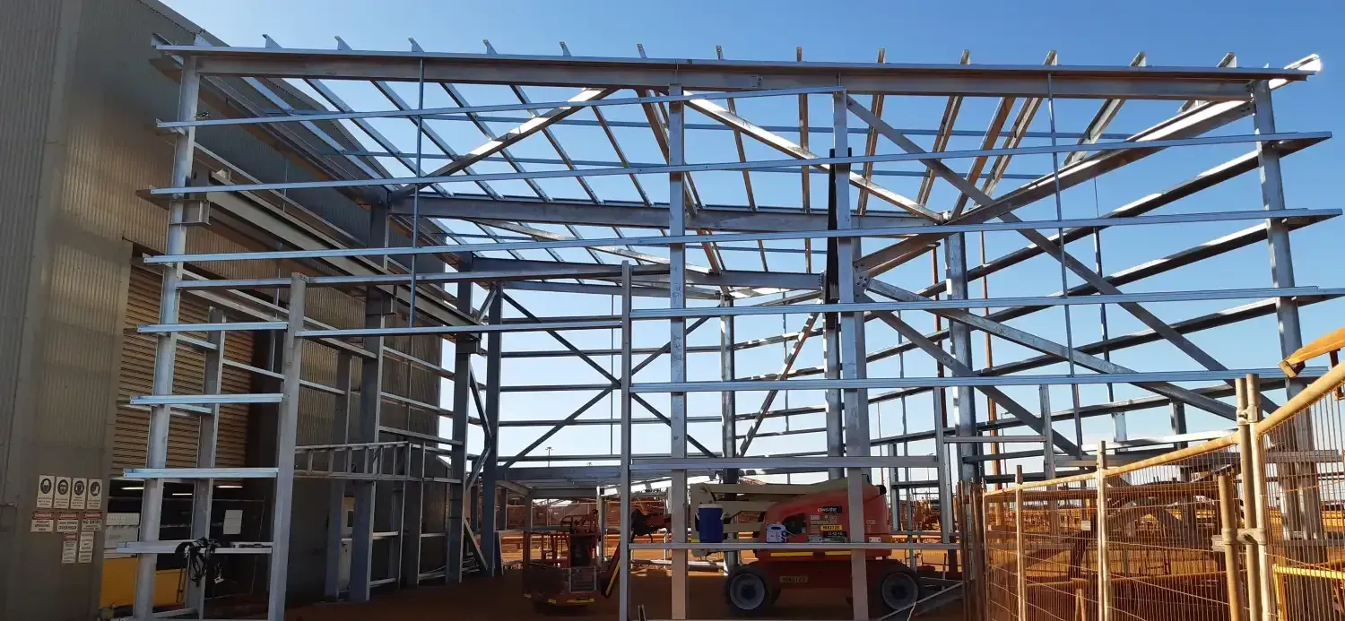 A Large Metal Structure Is Being Built On Top Of A Building — Jakes Steel & Welding in East Arm, NT