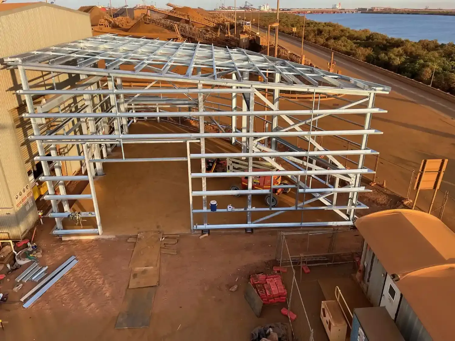 An Aerial View Of A Building Under Construction Next To A Body Of Water — Jakes Steel & Welding in East Arm, NT