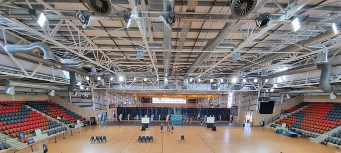 A Large Indoor Stadium With A Basketball Court And Bleachers — Jakes Steel & Welding in East Arm, NT