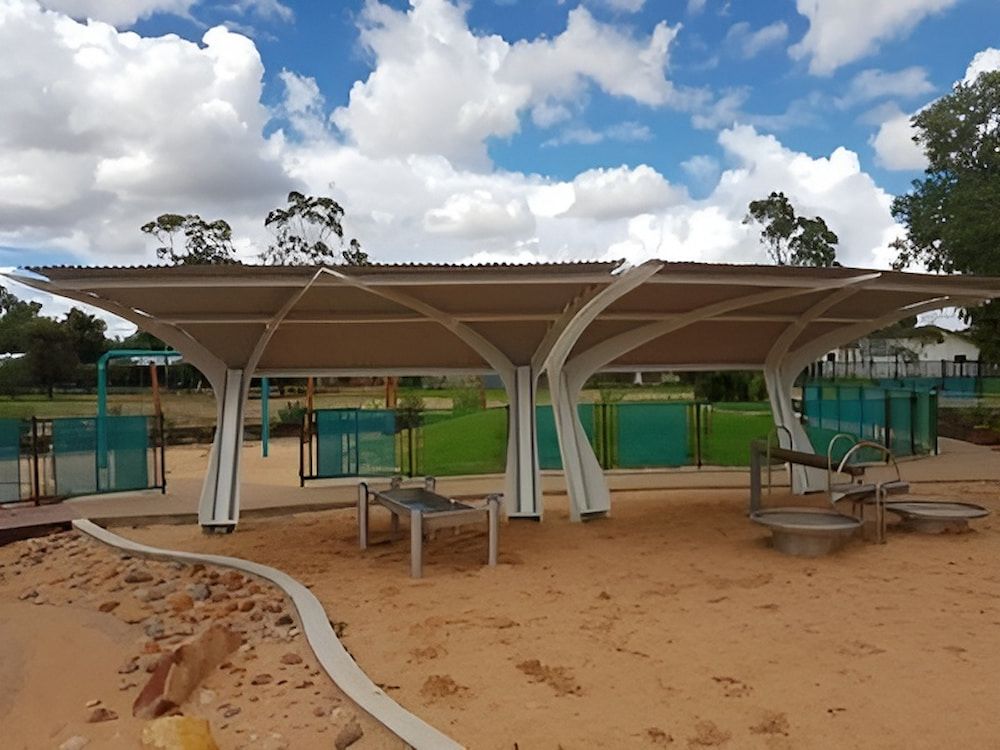 A Covered Area In A Park With Tables And Chairs Under A Canopy — Jakes Steel & Welding in East Arm, NT