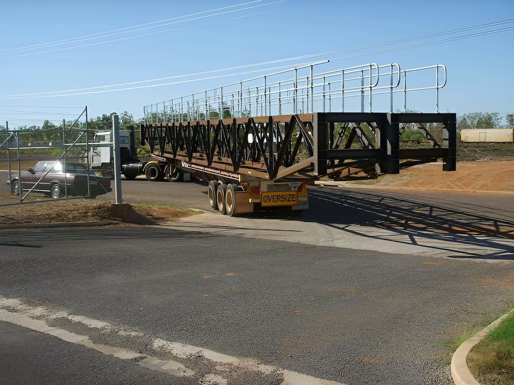 A Truck Is Carrying A Bridge On A Trailer — Jakes Steel & Welding in East Arm, NT