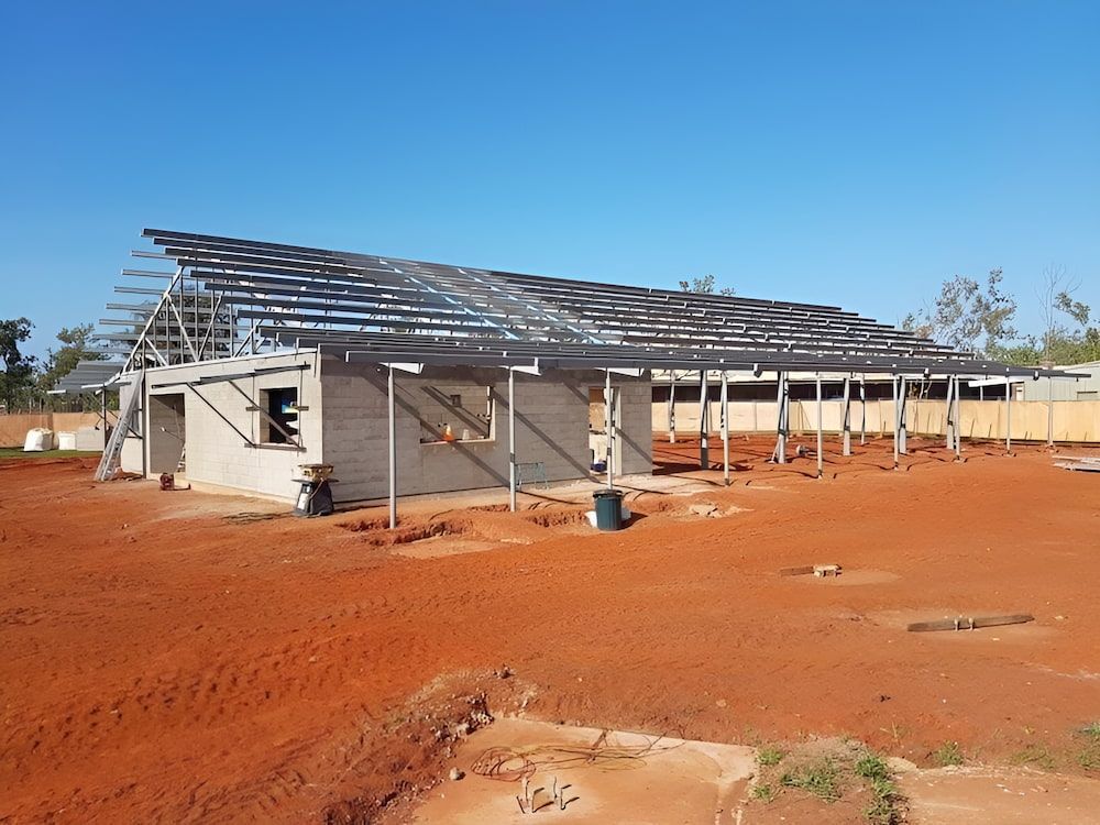 A Building Is Being Built In The Middle Of A Dirt Field — Jakes Steel & Welding in East Arm, NT