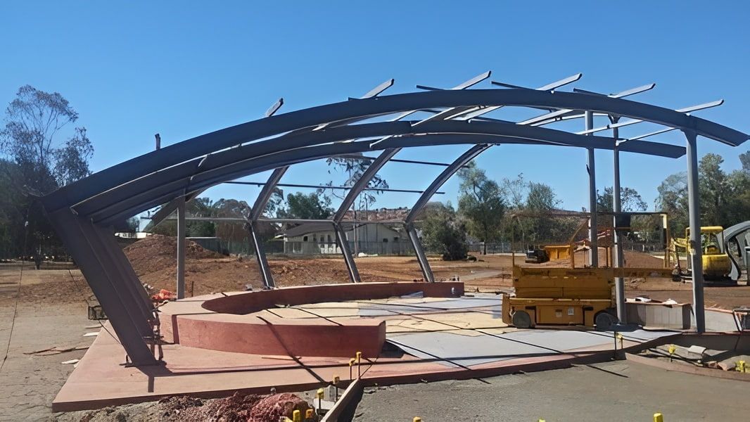 A Large Metal Structure Is Being Built In A Field — Jakes Steel & Welding in East Arm, NT