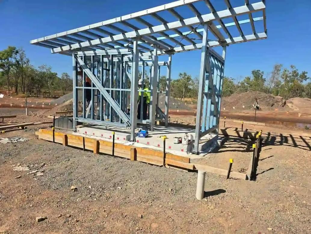 A Building Is Being Built In The Middle Of A Dirt Field — Jakes Steel & Welding in East Arm, NT