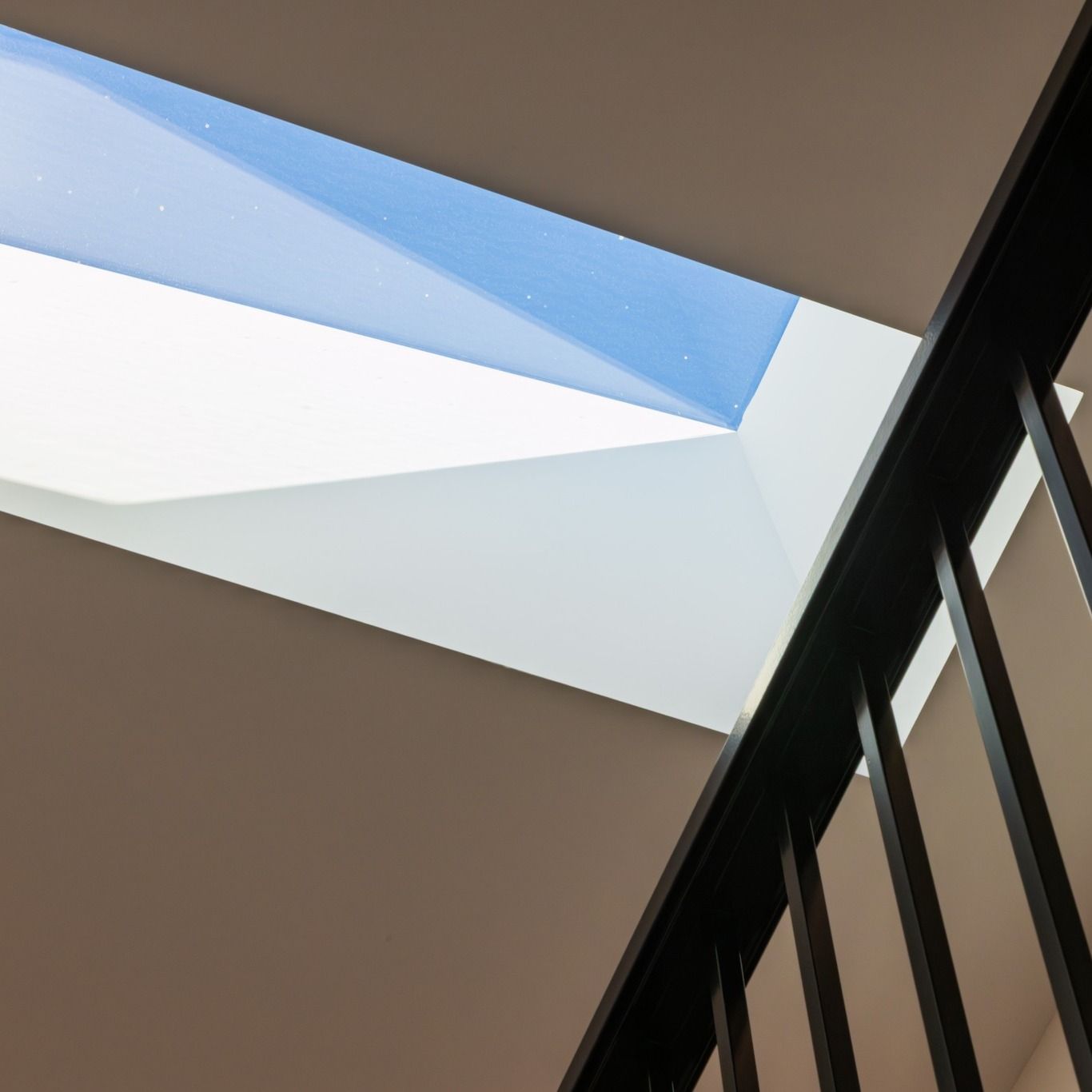 Skylight and black balustrade detail inside a custom home in Islington