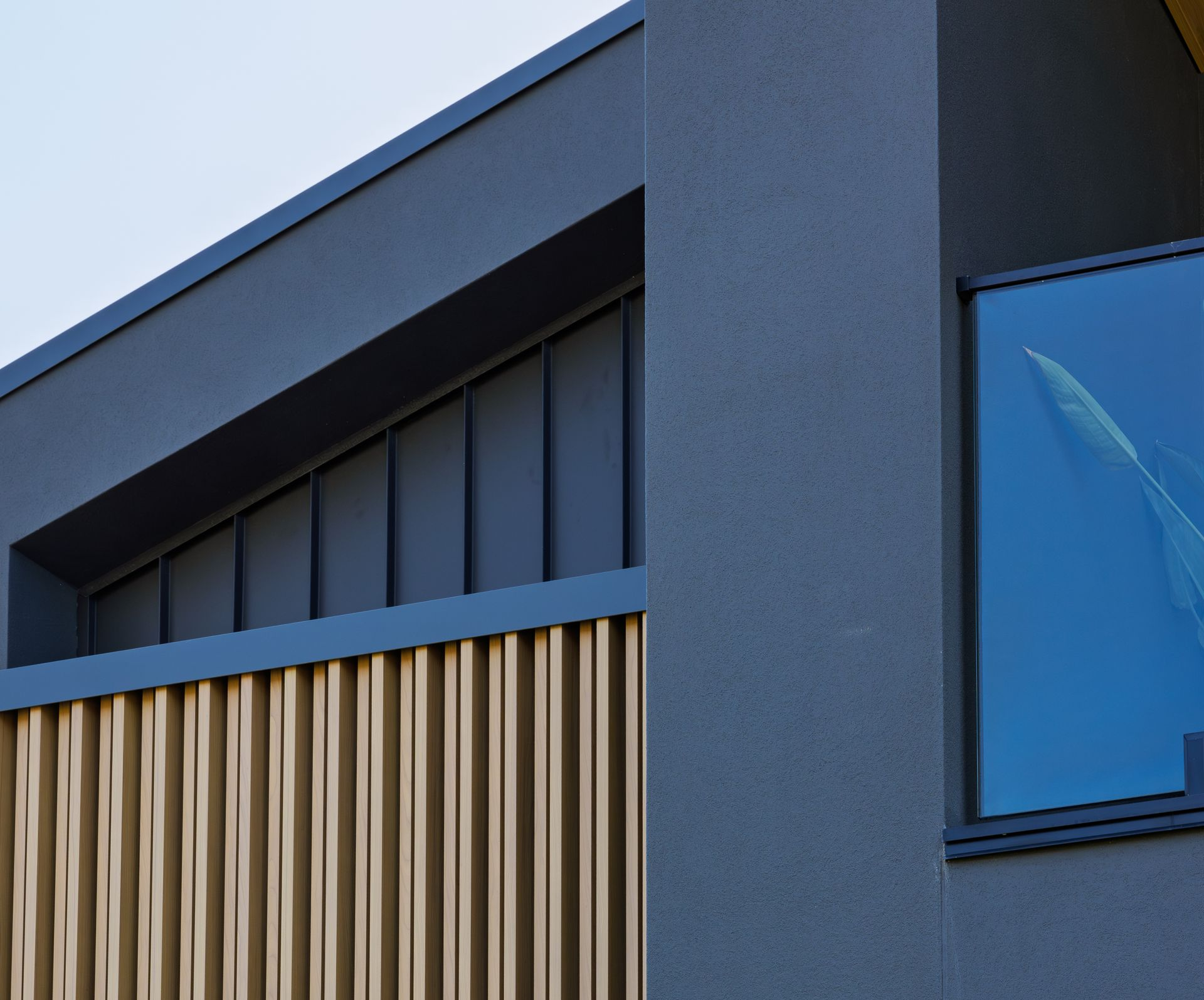 Modern custom home exterior with vertical timber detailing by Yarrum Designer Homes.