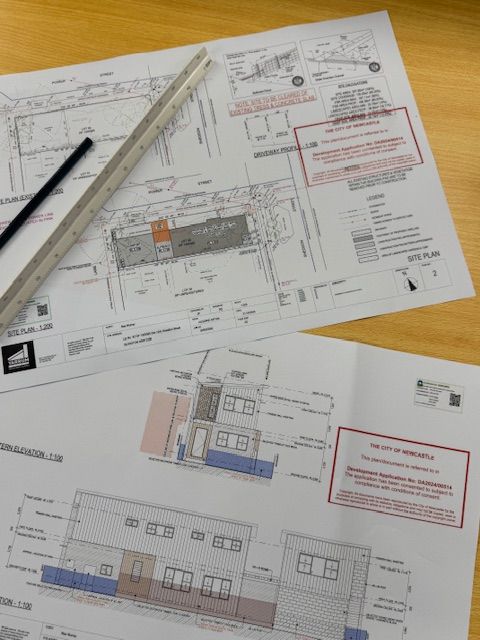 Photo of Council Approved plan on a desk