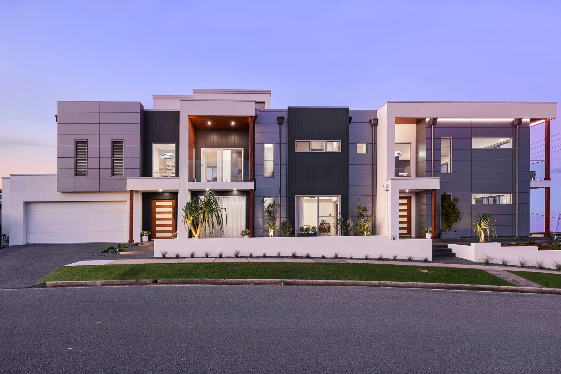 Luxury modern duplex with two storey facade, balconies, and coastal inspired design