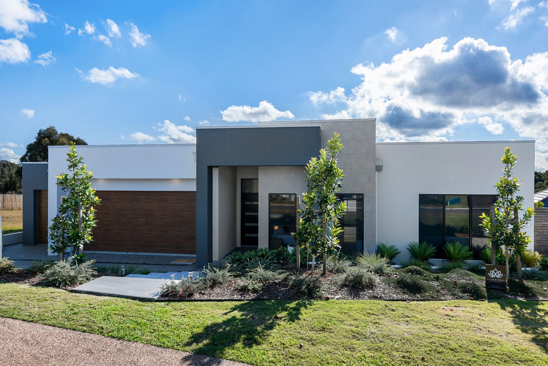 Vintage golf & reds front view Yarrum Designer Homes luxury residence with landscaped entrance 