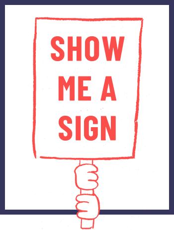 Person holding a sign that says