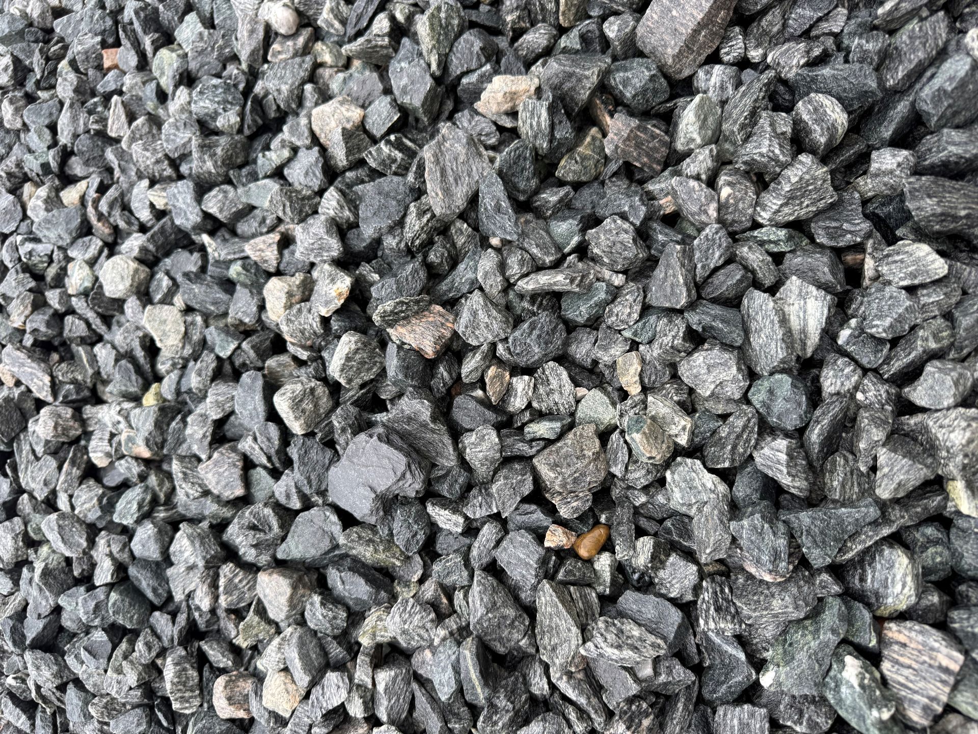 Pile of small gray gravel stones filling the frame.