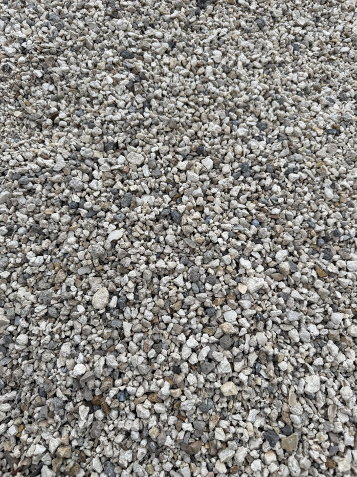 Close-up of small gray gravel stones covering the ground.
