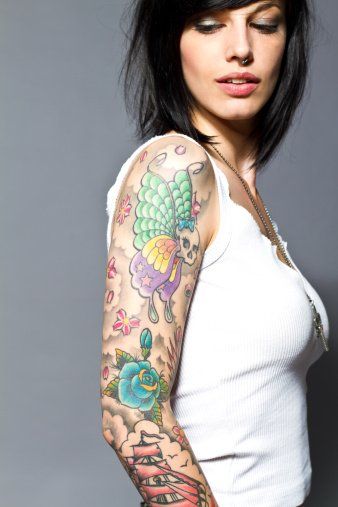 Woman with Beautiful Colored Tattoo — South Bend, IN — Electric Rose Inc Woman with Beautiful Colored Tattoo — South Bend, IN — Electric Rose Inc
