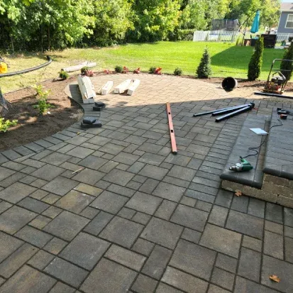 Backyard patio construction in Loretto MN enhancing outdoor entertainment areas with functional hardscape design