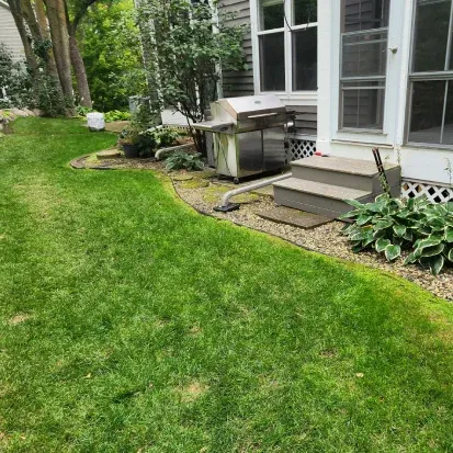 Built in grill outdoor kitchen in Loretto MN providing a convenient and modern backyard cooking setup