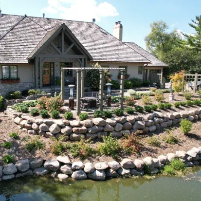 Custom stone retaining walls in Loretto MN enhancing landscape design while stabilizing sloped areas