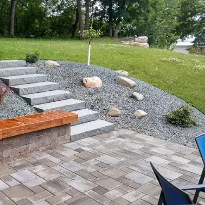 Custom yard boulder design in Loretto MN improving curb appeal with natural stone accents