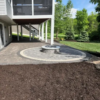 Decorative mulch spread service in Loretto MN adding color texture and protection to residential landscapes