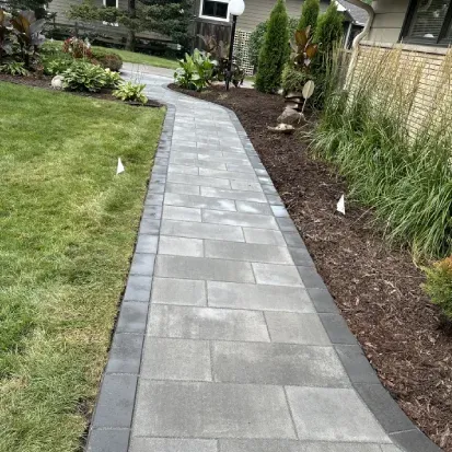 Garden bed mulching in Loretto MN helping control weeds and protect plants while improving curb appeal