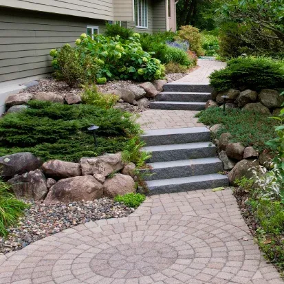 Large rock boulder landscaping in Loretto MN creating durable and visually striking outdoor features
