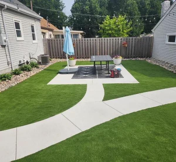 Backyard putting green installation in Loretto MN creating a custom golf practice area for residential outdoor spaces