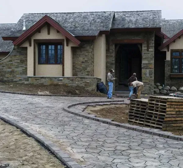 Custom driveway installation in Loretto MN creating durable and attractive vehicle access for residential properties