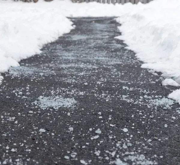 Deicing services in Loretto MN improving safety by removing ice buildup from driveways walkways and outdoor surfaces