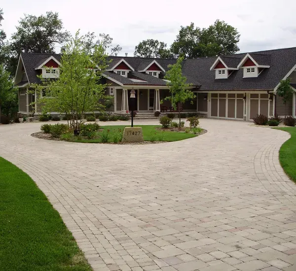 Custom driveway installation in Loretto MN creating durable and attractive vehicle access for residential properties