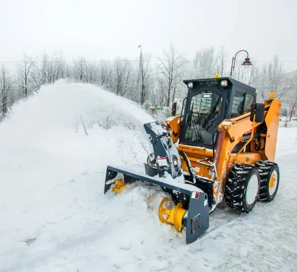 Snow blowing services in Loretto MN clearing driveways sidewalks and walkways for safe winter access