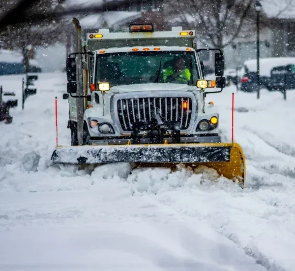 Snow relocation services in Loretto MN moving and clearing large snow piles to improve property access and visibility