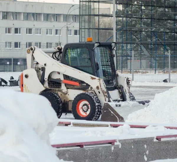 Snow removal services in Loretto MN clearing driveways walkways and properties for safe winter access