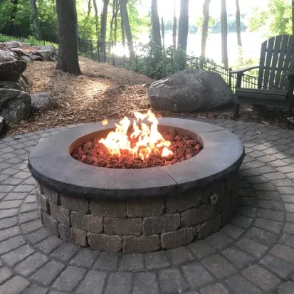 Paver fire pit installation in Loretto MN adding a stylish and functional centerpiece to outdoor patios