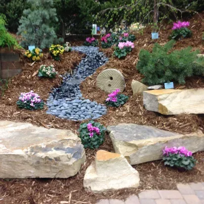 Seasonal landscape flower installation in Loretto MN bringing vibrant flowers and texture to garden spaces